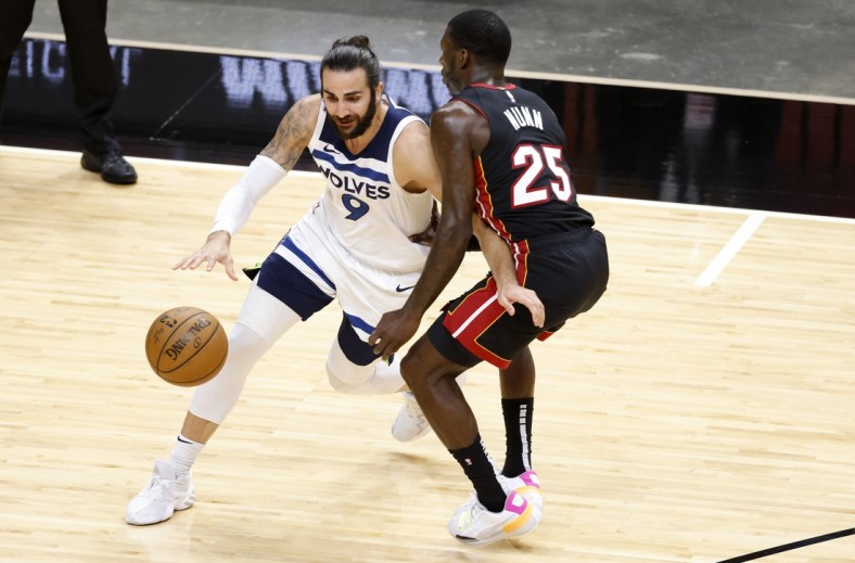 May 7, 2021; Miami, Florida, USA; Minnesota Timberwolves guard Ricky Rubio (9) dribbles the ball while defended by Miami Heat guard Kendrick Nunn (25) during the first half at American Airlines Arena. Mandatory Credit: Rhona Wise-USA TODAY Sports