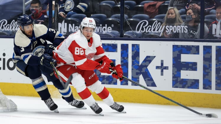May 7, 2021; Columbus, Ohio, USA; Columbus Blue Jackets defenseman Seth Jones (3) skates as Detroit Red Wings left wing Mathias Brome (86) controls the puck in the second period at Nationwide Arena. Mandatory Credit: Aaron Doster-USA TODAY Sports