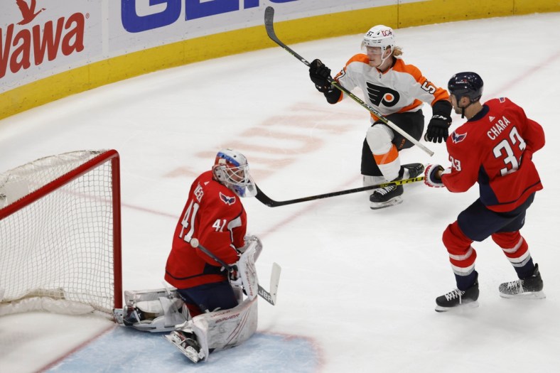 May 7, 2021; Washington, District of Columbia, USA; Philadelphia Flyers right wing Wade Allison (57) scores a goal on Washington Capitals goaltender Vitek Vanecek (41) in the second period at Capital One Arena. Mandatory Credit: Geoff Burke-USA TODAY Sports