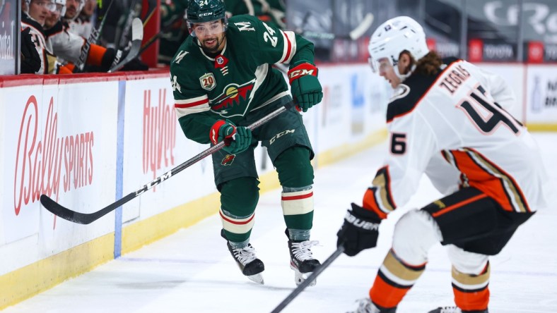 May 7, 2021; Saint Paul, Minnesota, USA; Minnesota Wild defenseman Matt Dumba (24) watches the puck as he defends Anaheim Ducks center Trevor Zegras (46) during the first period at Xcel Energy Center. Mandatory Credit: Harrison Barden-USA TODAY Sports