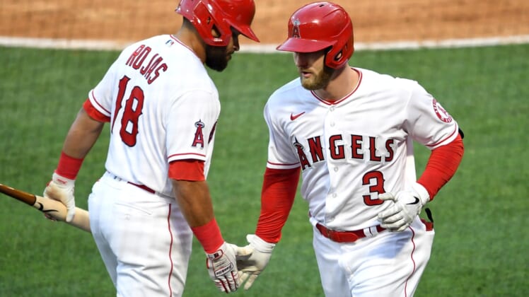 May 7, 2021; Anaheim, California, USA; Los Angeles Angels right fielder Taylor Ward (3) is greeted by third baseman Jose Rojas (18) after hitting a solo home run during the second inning against the Los Angeles Dodgers at Angel Stadium. Mandatory Credit: Jayne Kamin-Oncea-USA TODAY Sports