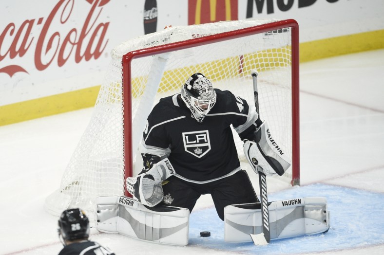 May 7, 2021; Los Angeles, California, USA; Colorado Avalanche center Tyson Jost (17) scores a goal between the legs of Los Angeles Kings goalie Calvin Petersen (40) during the second period at Staples Center. Mandatory Credit: Kelvin Kuo-USA TODAY Sports