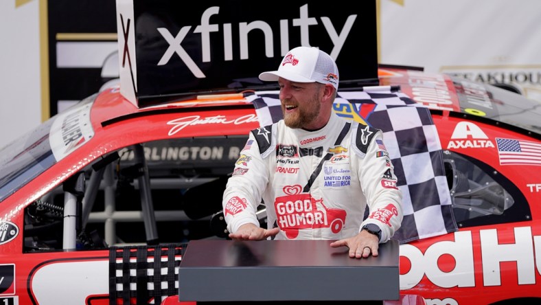 May 8, 2021; Darlington, SC, USA; NASCAR Xfinity Series driver Justin Allgaier celebrates after winning the Steakhouse Elite 200 at Darlington Raceway. Mandatory Credit: Jasen Vinlove-USA TODAY Sports