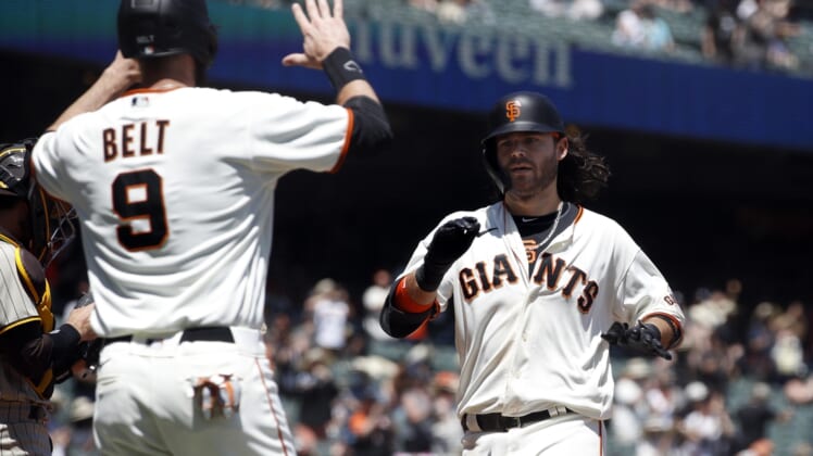 May 8, 2021; San Francisco, California, USA; San Francisco Giants shortstop Brandon Crawford (35) celebrates with first baseman Brandon Belt (9) after hitting a home run during the second inning against the San Diego Padres at Oracle Park. Mandatory Credit: Darren Yamashita-USA TODAY Sports