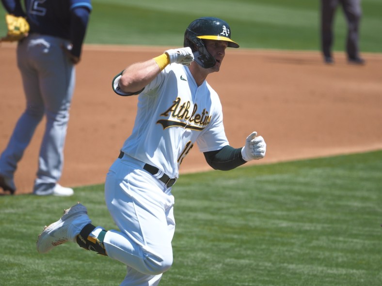 May 8, 2021; Oakland, California, USA; Oakland Athletics right fielder Seth Brown (15) celebrates as he rounds third base on a two run home run against the Tampa Bay Rays during the first inning at RingCentral Coliseum. Mandatory Credit: Kelley L Cox-USA TODAY Sports