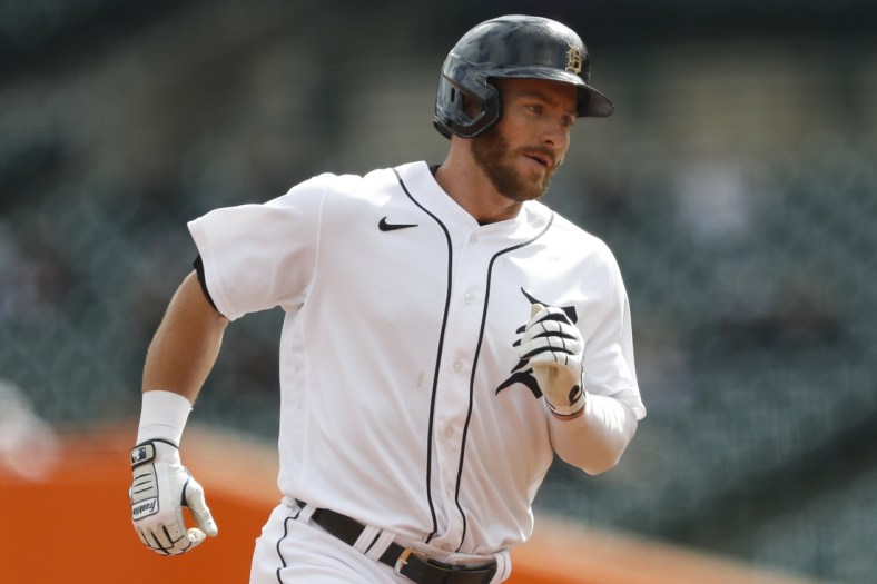 May 8, 2021; Detroit, Michigan, USA; Detroit Tigers left fielder Robbie Grossman (8) rounds the bases after hitting a solo home run during the first inning against the Minnesota Twins at Comerica Park. Mandatory Credit: Raj Mehta-USA TODAY Sports