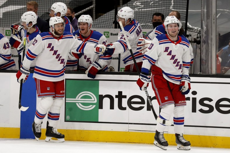 May 8, 2021; Boston, Massachusetts, USA; New York Rangers left wing Alexis Lafreni re (13) smiles after being congratulated at the bench after scoring with defenseman Anthony Bitetto (22) during the third period of their 5-4 win over the Boston Bruins at TD Garden. Mandatory Credit: Winslow Townson-USA TODAY Sports