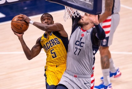 May 8, 2021; Indianapolis, Indiana, USA;  Indiana Pacers guard Edmond Sumner (5) shoots against Washington Wizards center Alex Len (27) during the first half of an NBA basketball game at Bankers Life Fieldhouse. Mandatory Credit: Doug McSchooler-USA TODAY Sports