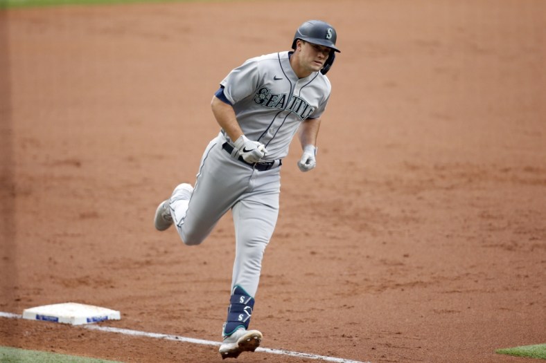 May 8, 2021; Arlington, Texas, USA; Seattle Mariners first baseman Evan White (12) rounds the bases after hitting a two run home run in the second inning against the Texas Rangers at Globe Life Field. Mandatory Credit: Tim Heitman-USA TODAY Sports