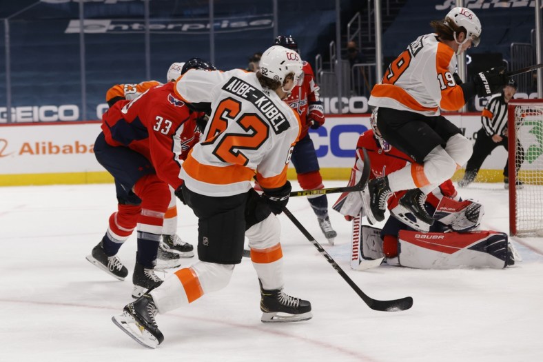 May 8, 2021; Washington, District of Columbia, USA; Philadelphia Flyers center Nolan Patrick (19) screens Washington Capitals goaltender Craig Anderson (31) on a shot by Flyers right wing Nicolas Aube-Kubel (62) in the first period at Capital One Arena. Mandatory Credit: Geoff Burke-USA TODAY Sports