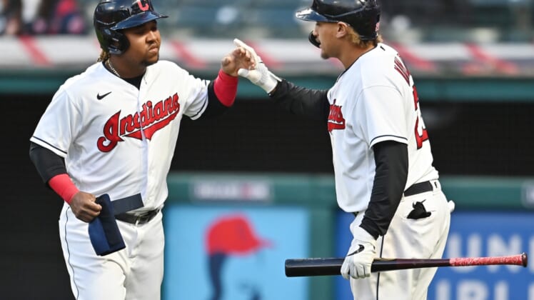 May 8, 2021; Cleveland, Ohio, USA; Cleveland Indians third baseman Jose Ramirez (left) celebrates with right fielder Josh Naylor (22) after scoring against the Cincinnati Reds during the sixth inning at Progressive Field. Mandatory Credit: Ken Blaze-USA TODAY Sports