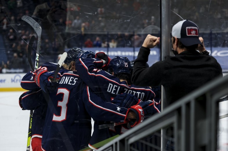 May 8, 2021; Columbus, Ohio, USA; Columbus Blue Jackets center Jack Roslovic (right) celebrates with teammates after scoring a goal against the Detroit Red Wings in the third period at Nationwide Arena. Mandatory Credit: Aaron Doster-USA TODAY Sports