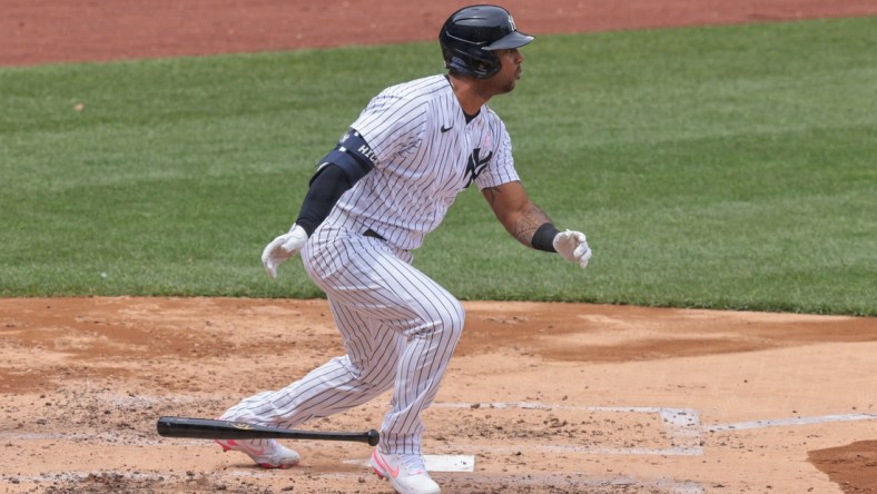 May 9, 2021; Bronx, New York, USA; New York Yankees center fielder Aaron Hicks (31) hits an RBI single during the third inning against the Washington Nationals at Yankee Stadium. Mandatory Credit: Vincent Carchietta-USA TODAY Sports