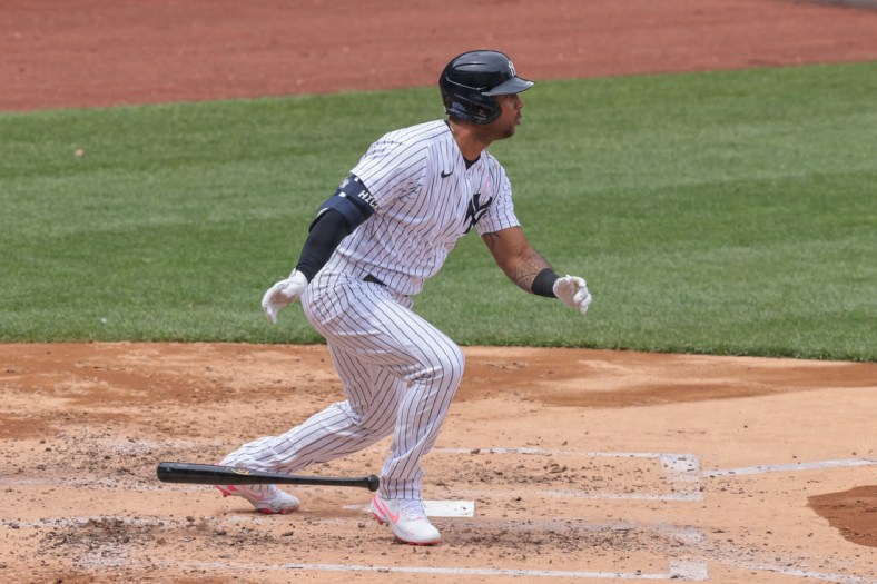 May 9, 2021; Bronx, New York, USA; New York Yankees center fielder Aaron Hicks (31) hits an RBI single during the third inning against the Washington Nationals at Yankee Stadium. Mandatory Credit: Vincent Carchietta-USA TODAY Sports