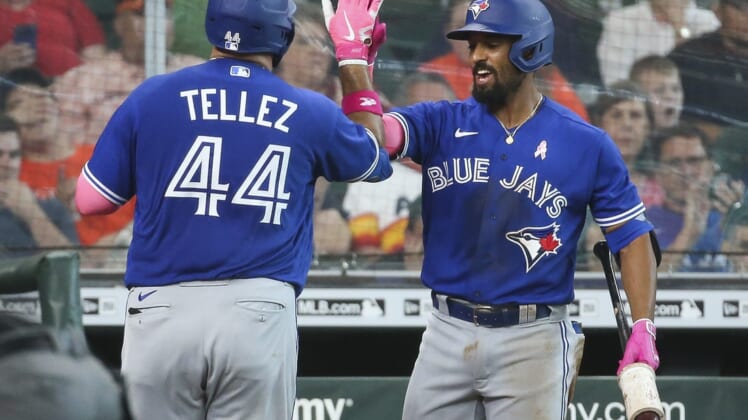 May 9, 2021; Houston, Texas, USA; Toronto Blue Jays first baseman Rowdy Tellez (44) celebrates with second baseman Marcus Semien (R) after hitting a home run during the fifth inning against the Houston Astros at Minute Maid Park. Mandatory Credit: Troy Taormina-USA TODAY Sports