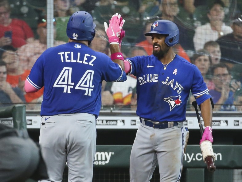 May 9, 2021; Houston, Texas, USA; Toronto Blue Jays first baseman Rowdy Tellez (44) celebrates with second baseman Marcus Semien (R) after hitting a home run during the fifth inning against the Houston Astros at Minute Maid Park. Mandatory Credit: Troy Taormina-USA TODAY Sports