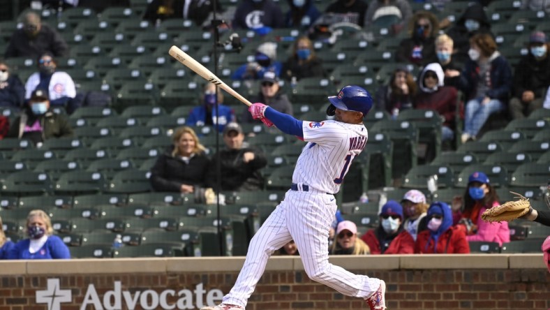 May 9, 2021; Chicago, Illinois, USA;  Chicago Cubs second baseman Ildemaro Vargas (16) hits a two rbi double during the ninth inning against the Pittsburgh Pirates at Wrigley Field. Mandatory Credit: Matt Marton-USA TODAY Sports