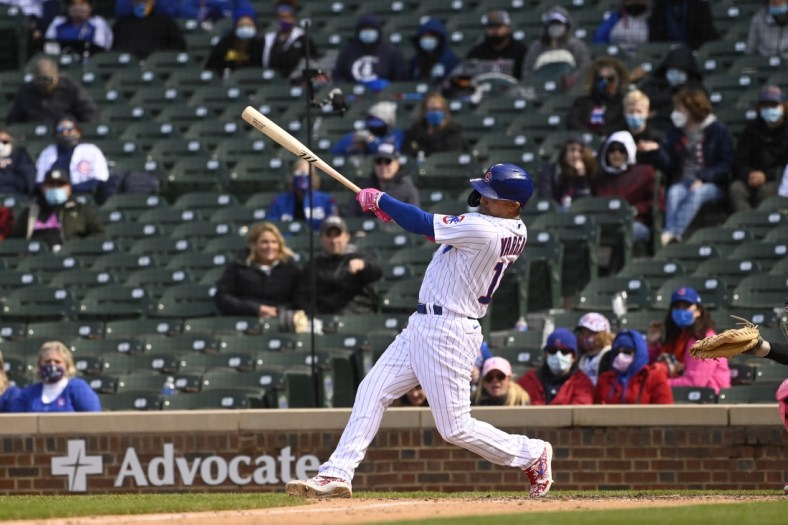 May 9, 2021; Chicago, Illinois, USA;  Chicago Cubs second baseman Ildemaro Vargas (16) hits a two rbi double during the ninth inning against the Pittsburgh Pirates at Wrigley Field. Mandatory Credit: Matt Marton-USA TODAY Sports