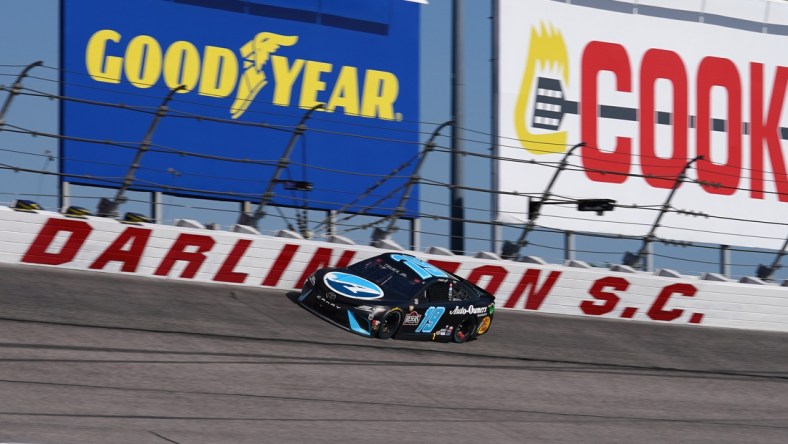 May 9, 2021; Darlington, South Carolina, USA; NASCAR Cup Series driver Martin Truex Jr. (19) races during the Goodyear 400 at Darlington Raceway. Mandatory Credit: Jasen Vinlove-USA TODAY Sports