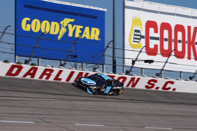 May 9, 2021; Darlington, South Carolina, USA; NASCAR Cup Series driver Martin Truex Jr. (19) races during the Goodyear 400 at Darlington Raceway. Mandatory Credit: Jasen Vinlove-USA TODAY Sports