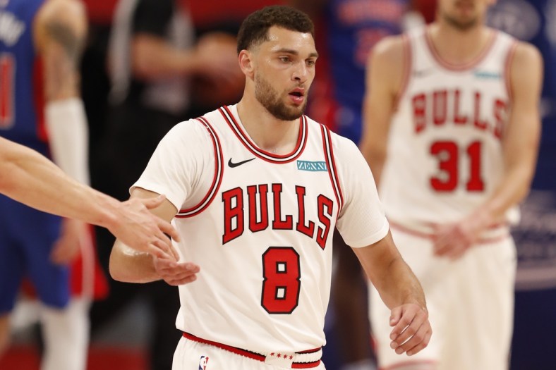 May 9, 2021; Detroit, Michigan, USA; Chicago Bulls guard Zach LaVine (8) gives five to a teammate as he walks to the bench during the second quarter against the Detroit Pistons at Little Caesars Arena. Mandatory Credit: Raj Mehta-USA TODAY Sports