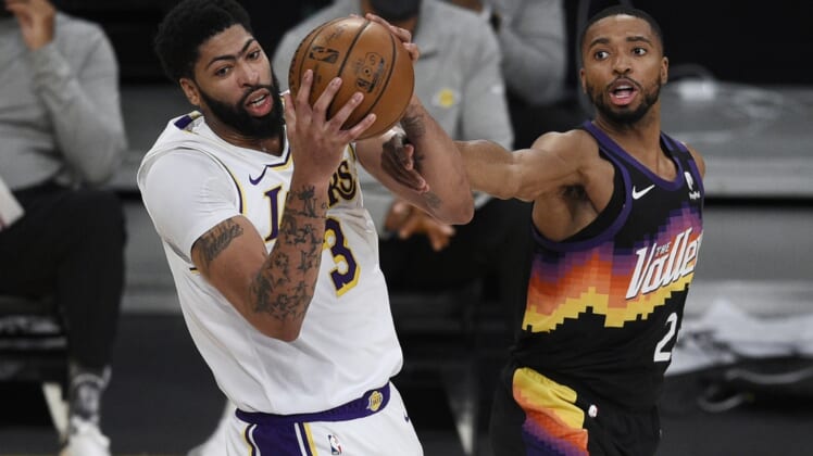 May 9, 2021; Los Angeles, California, USA; Los Angeles Lakers forward Anthony Davis (3) grabs the rebound against Phoenix Suns forward Mikal Bridges (25) during the first half at Staples Center. Mandatory Credit: Kelvin Kuo-USA TODAY Sports
