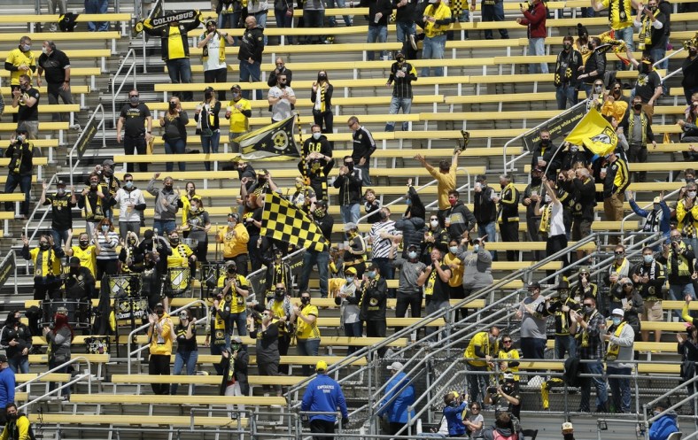 Socially distanced fans celebrate in an MLS game against D.C. United at Crew Stadium in May. News that the team would officially be known as Columbus SC has created a backlash from many fans.

Columbus Crew Sc Vs Dc United