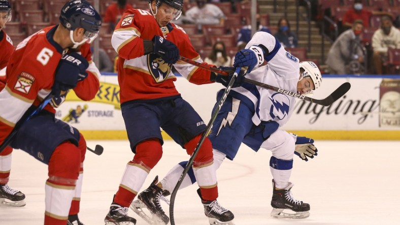 May 10, 2021; Sunrise, Florida, USA; Tampa Bay Lightning center Ross Colton (79) and Florida Panthers defenseman Markus Nutivaara (65) battle for the puck during the first period at BB&T Center. Mandatory Credit: Sam Navarro-USA TODAY Sports