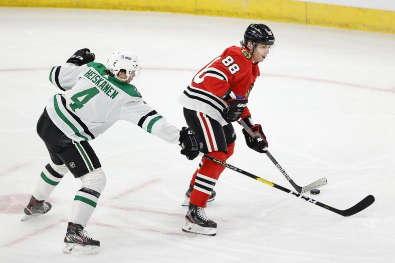 May 10, 2021; Chicago, Illinois, USA; Chicago Blackhawks right wing Patrick Kane (88) looks to pass the puck away from Dallas Stars defenseman Miro Heiskanen (4) during the first period at United Center. Mandatory Credit: Kamil Krzaczynski-USA TODAY Sports