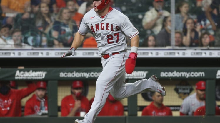 May 10, 2021; Houston, Texas, USA; Los Angeles Angels center fielder Mike Trout (27) runs towards home plate to score a run during the fourth inning against the Houston Astros at Minute Maid Park. Mandatory Credit: Troy Taormina-USA TODAY Sports