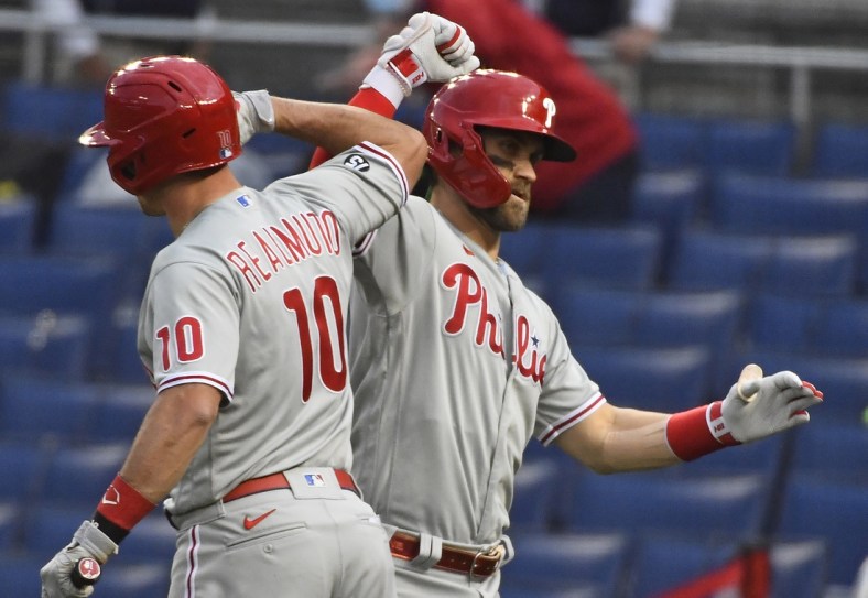 May 11, 2021; Washington, District of Columbia, USA; Philadelphia Phillies right fielder Bryce Harper (3) celebrates with catcher J.T. Realmuto (10) after hitting a solo home run against the Washington Nationals during the first inning at Nationals Park. Mandatory Credit: Brad Mills-USA TODAY Sports