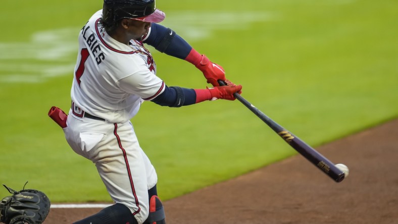 May 11, 2021; Cumberland, Georgia, USA; Atlanta Braves second baseman Ozzie Albies (1) hits an RBI single against the Toronto Blue Jays during the first inning at Truist Park. Mandatory Credit: Dale Zanine-USA TODAY Sports