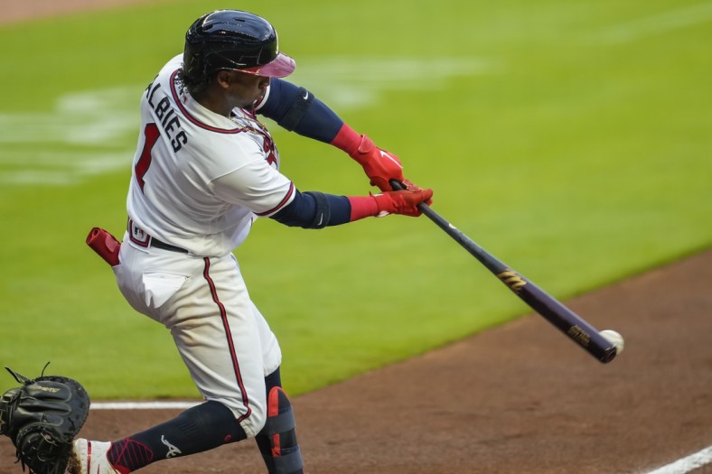 May 11, 2021; Cumberland, Georgia, USA; Atlanta Braves second baseman Ozzie Albies (1) hits an RBI single against the Toronto Blue Jays during the first inning at Truist Park. Mandatory Credit: Dale Zanine-USA TODAY Sports