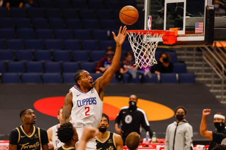 May 11, 2021; Tampa, Florida, USA;  LA Clippers forward Kawhi Leonard (2) goes up for a shot in the first quarter against the Toronto Raptors at Amalie Arena. Mandatory Credit: Nathan Ray Seebeck-USA TODAY Sports
