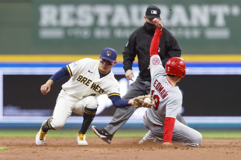 May 11, 2021; Milwaukee, Wisconsin, USA;  St. Louis Cardinals second baseman Tommy Edman (19) steals second base behind Milwaukee Brewers shortstop Luis Ur  as (2) during the third inning at American Family Field. Mandatory Credit: Jeff Hanisch-USA TODAY Sports