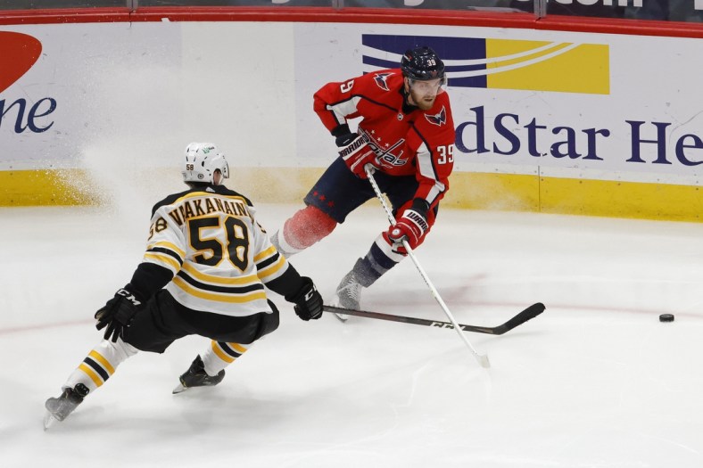 May 11, 2021; Washington, District of Columbia, USA; Washington Capitals right wing Anthony Mantha (39) skates with the puck as Boston Bruins defenseman Urho Vaakanainen (58) defends in the third period at Capital One Arena. Mandatory Credit: Geoff Burke-USA TODAY Sports