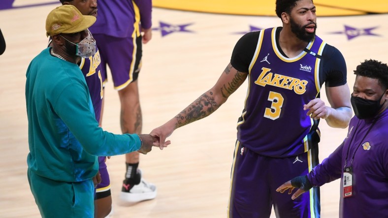 May 11, 2021; Los Angeles, California, USA; Los Angeles Lakers forward LeBron James (L) celebrates with forward Anthony Davis (3) after defeating the New York Knicks in overtime at Staples Center. Mandatory Credit: Jayne Kamin-Oncea-USA TODAY Sports