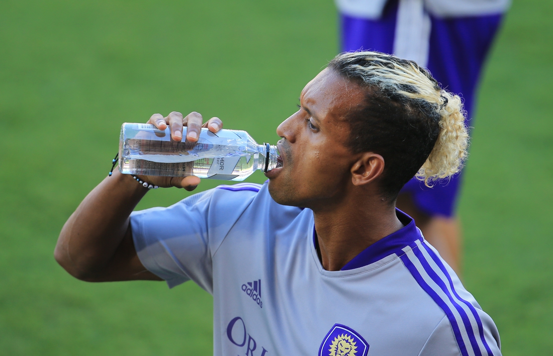 May 8, 2021; Orlando, Florida, USA; Orlando City forward Nani (17) takes a drink while warming up before the match against New York City at Orlando City Stadium. Mandatory Credit: Matt Stamey-USA TODAY Sports