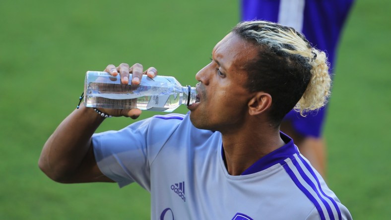 May 8, 2021; Orlando, Florida, USA; Orlando City forward Nani (17) takes a drink while warming up before the match against New York City at Orlando City Stadium. Mandatory Credit: Matt Stamey-USA TODAY Sports