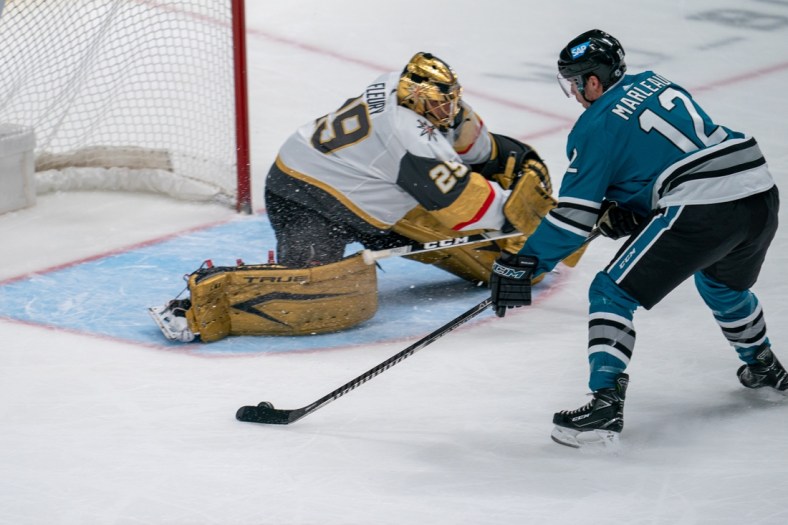 May 12, 2021; San Jose, California, USA; San Jose Sharks center Patrick Marleau (12) shoots the puck against Vegas Golden Knights goaltender Marc-Andre Fleury (29) during the first period at SAP Center at San Jose. Mandatory Credit: Neville E. Guard-USA TODAY Sports
