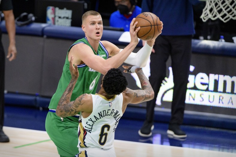 May 12, 2021; Dallas, Texas, USA; Dallas Mavericks center Kristaps Porzingis (6) shoots over New Orleans Pelicans guard Nickeil Alexander-Walker (6) during the second quarter at the American Airlines Center. Mandatory Credit: Jerome Miron-USA TODAY Sports