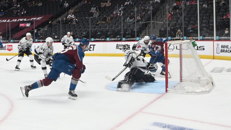 May 12, 2021; Denver, Colorado, USA; Colorado Avalanche left wing J.T. Compher (37) scores a goal past Los Angeles Kings goaltender Calvin Petersen (40) during the second period at Ball Arena. Mandatory Credit: Ron Chenoy-USA TODAY Sports