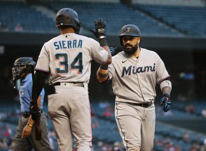 Miami Marlins catcher Sandy Leon (right) is congratulated by Magneuris Sierra (34) after hitting a solo home run against the Arizona Diamondbacks during the second inning at Chase Field May 12, 2021.

Marlins Vs Diamondbacks