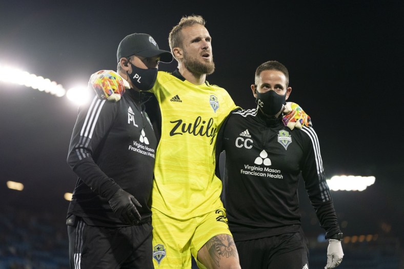 May 12, 2021; San Jose, California, USA; Seattle Sounders FC goalkeeper Stefan Frei (24) leaves the game after an injury during the second half against the San Jose Earthquakes at PayPal Park. Mandatory Credit: Kyle Terada-USA TODAY Sports