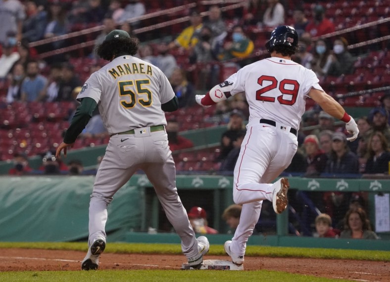 May 13, 2021; Boston, Massachusetts, USA; Boston Red Sox third baseman Bobby Dalbec (29) is called safe at first base against Oakland Athletics starting pitcher Sean Manaea (55) during the third inning at Fenway Park. Mandatory Credit: David Butler II-USA TODAY Sports