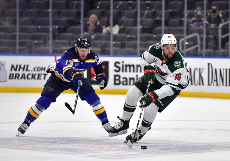 May 13, 2021; St. Louis, Missouri, USA;  Minnesota Wild left wing Jordan Greenway (18) handles the puck during the first period against the St. Louis Blues at Enterprise Center. Mandatory Credit: Jeff Curry-USA TODAY Sports