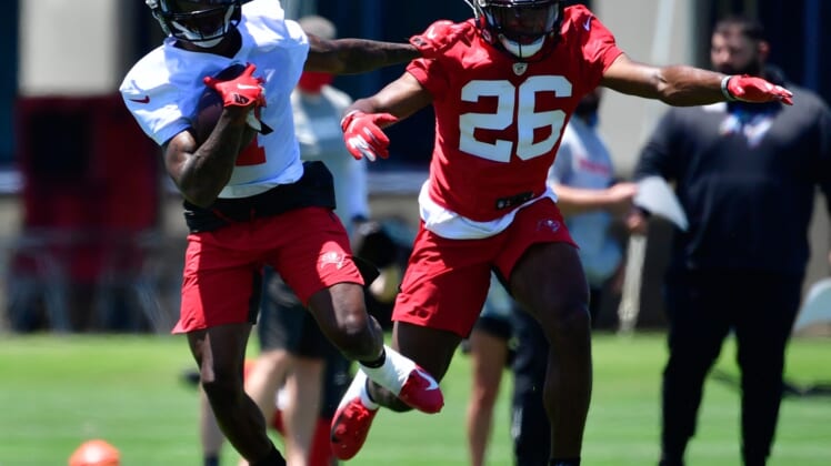 May 14, 2021; Tampa Bay, Florida, USA; Tampa Bay Buccaneers wide receiver Jaelon Darden (1) and corner back Cameron Kinley (26) practice during rookie mini-camp at AdventHealth Training Center Mandatory Credit: Douglas DeFelice-USA TODAY Sports