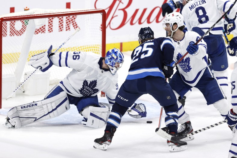 May 14, 2021; Winnipeg, Manitoba, CAN; Toronto Maple Leafs goaltender Jack Campbell (36) covers up the puck as Winnipeg Jets center Paul Stastny (25) looks for a rebound in the first period at Bell MTS Place. Mandatory Credit: James Carey Lauder-USA TODAY Sports