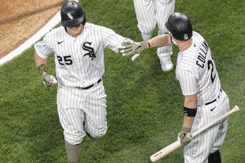 May 14, 2021; Chicago, Illinois, USA; Chicago White Sox first baseman Andrew Vaughn (25) celebrates with catcher Zack Collins (21) after hitting a two-run home run against the Kansas City Royals during the second inning of the second game of a doubleheader at Guaranteed Rate Field. Mandatory Credit: Kamil Krzaczynski-USA TODAY Sports
