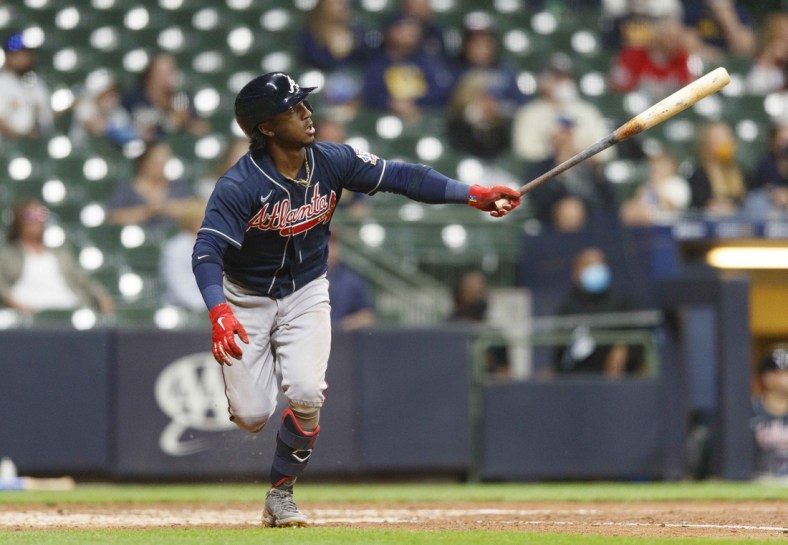 May 14, 2021; Milwaukee, Wisconsin, USA;  Atlanta Braves second baseman Ozzie Albies (1) hits a solo home run during the fifth inning against the Milwaukee Brewers at American Family Field. Mandatory Credit: Jeff Hanisch-USA TODAY Sports